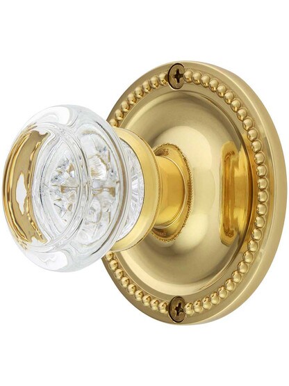 Large Beaded Rosette Door Set with Round Glass Knobs in Lacquered Brass.